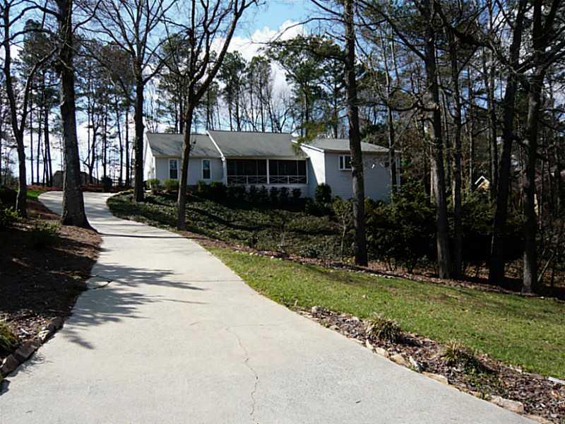 109 Dockside Downs Road Woodstock, GA 30189 - Photo 1 of 1 Exterior Front. Long driveway leads to this recently renovated home