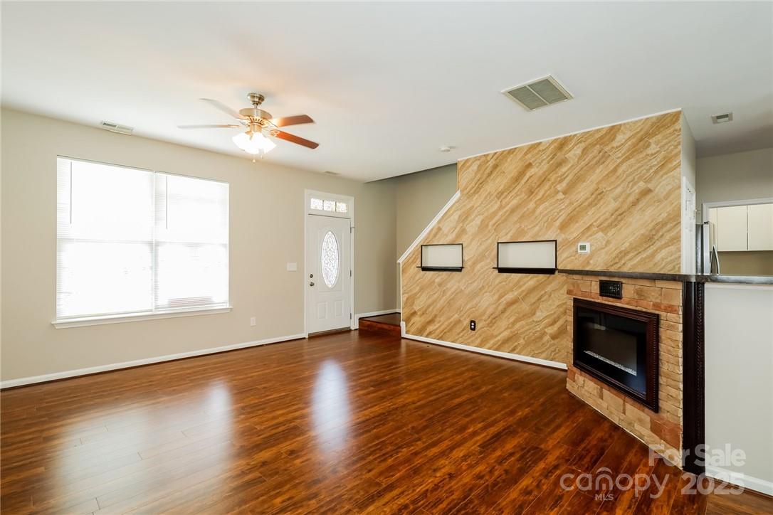 733 Jones Branch Road Fort Mill, SC 29715 - Photo 3 of 15 a view of an empty room with wooden floor and a window