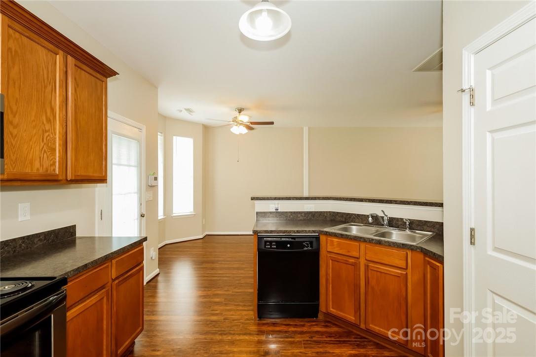 733 Jones Branch Road Fort Mill, SC 29715 - Photo 6 of 15 a kitchen with stainless steel appliances granite countertop a stove a sink and a refrigerator