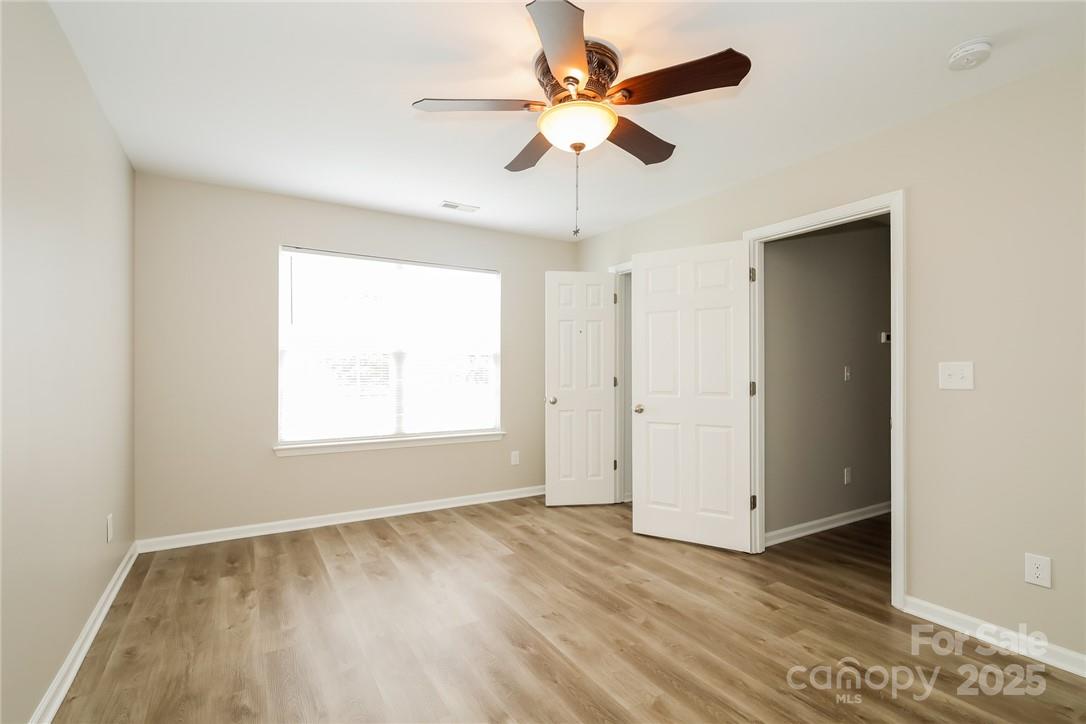 733 Jones Branch Road Fort Mill, SC 29715 - Photo 9 of 15 wooden floor in an empty room with a window