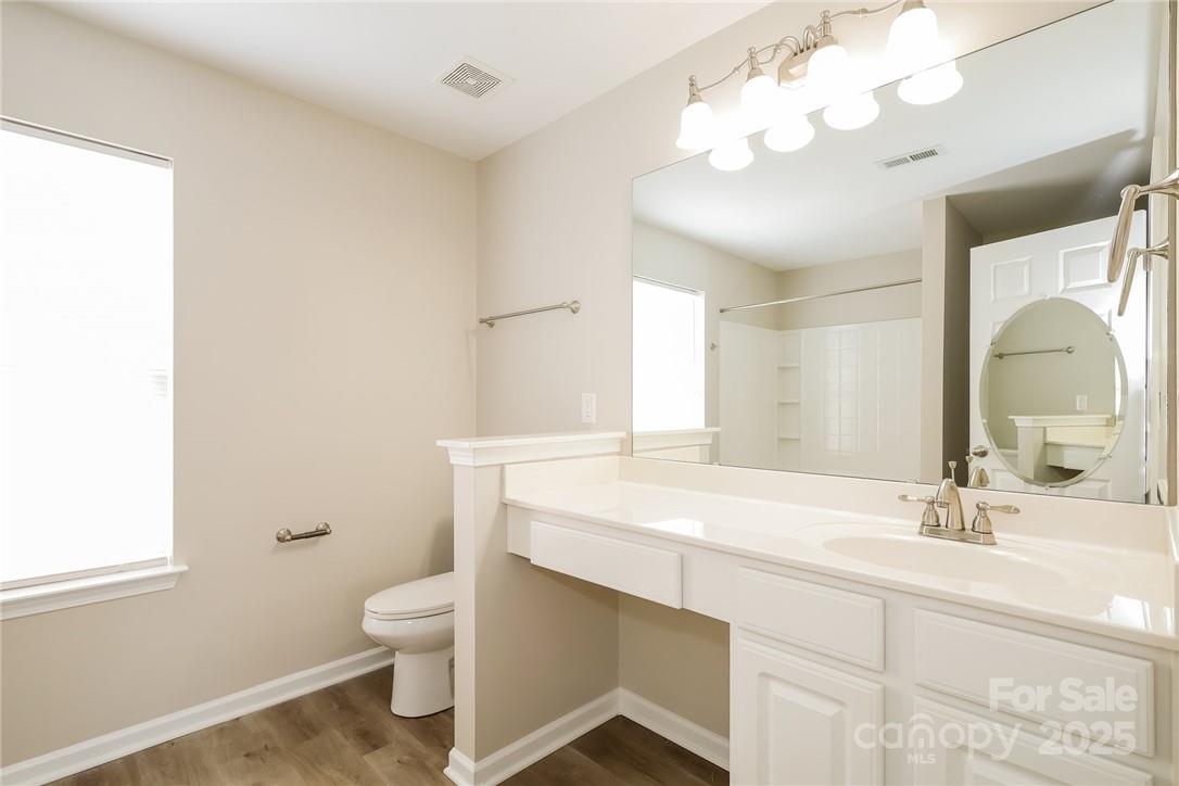 733 Jones Branch Road Fort Mill, SC 29715 - Photo 10 of 15 a bathroom with a sink vanity mirror and toilet