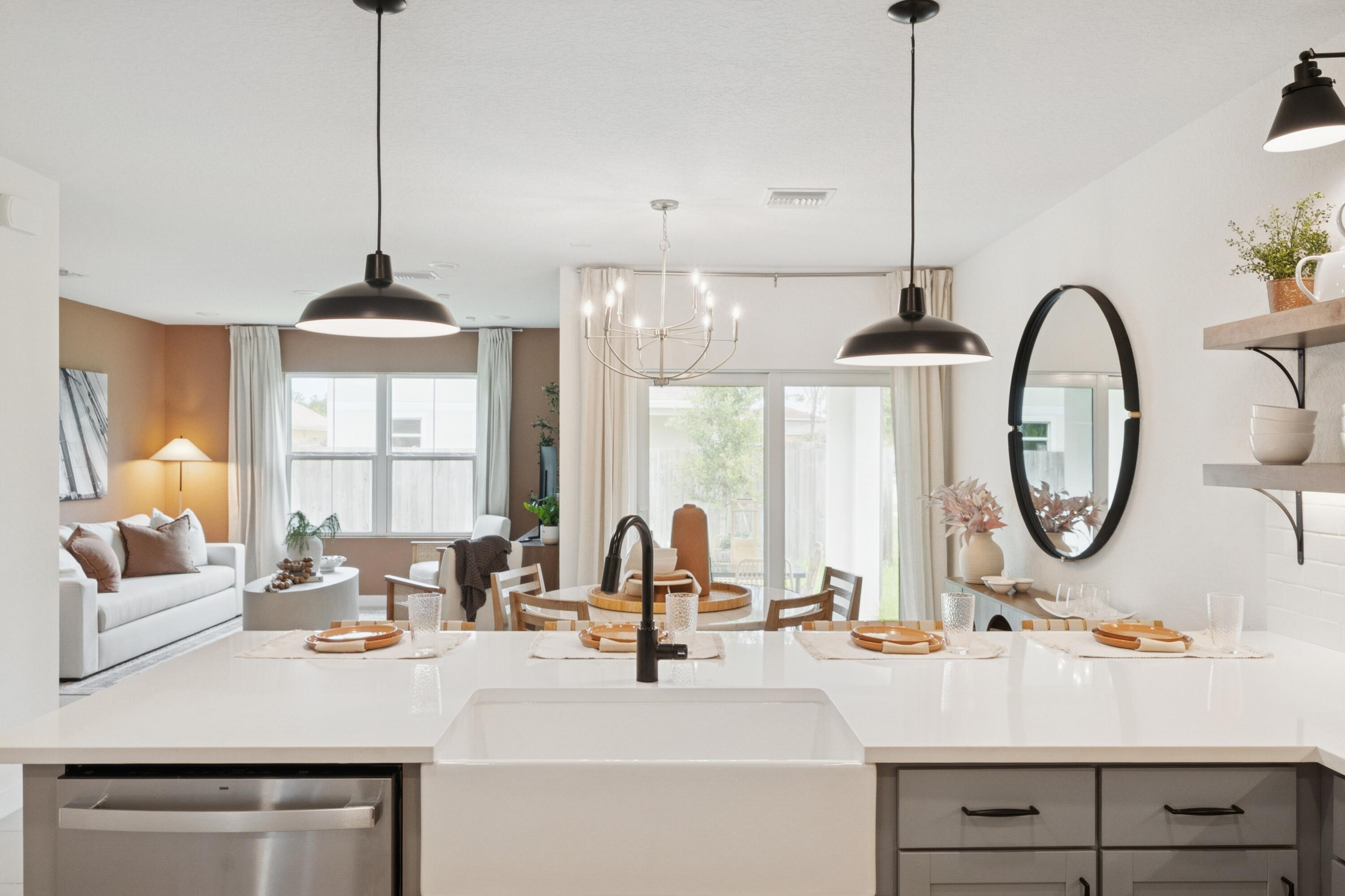 9744 Apollo Avenue, Unit 1 Fort Pierce, FL 34945 - Photo 20 of 39 a kitchen with a sink a chandelier and a large window