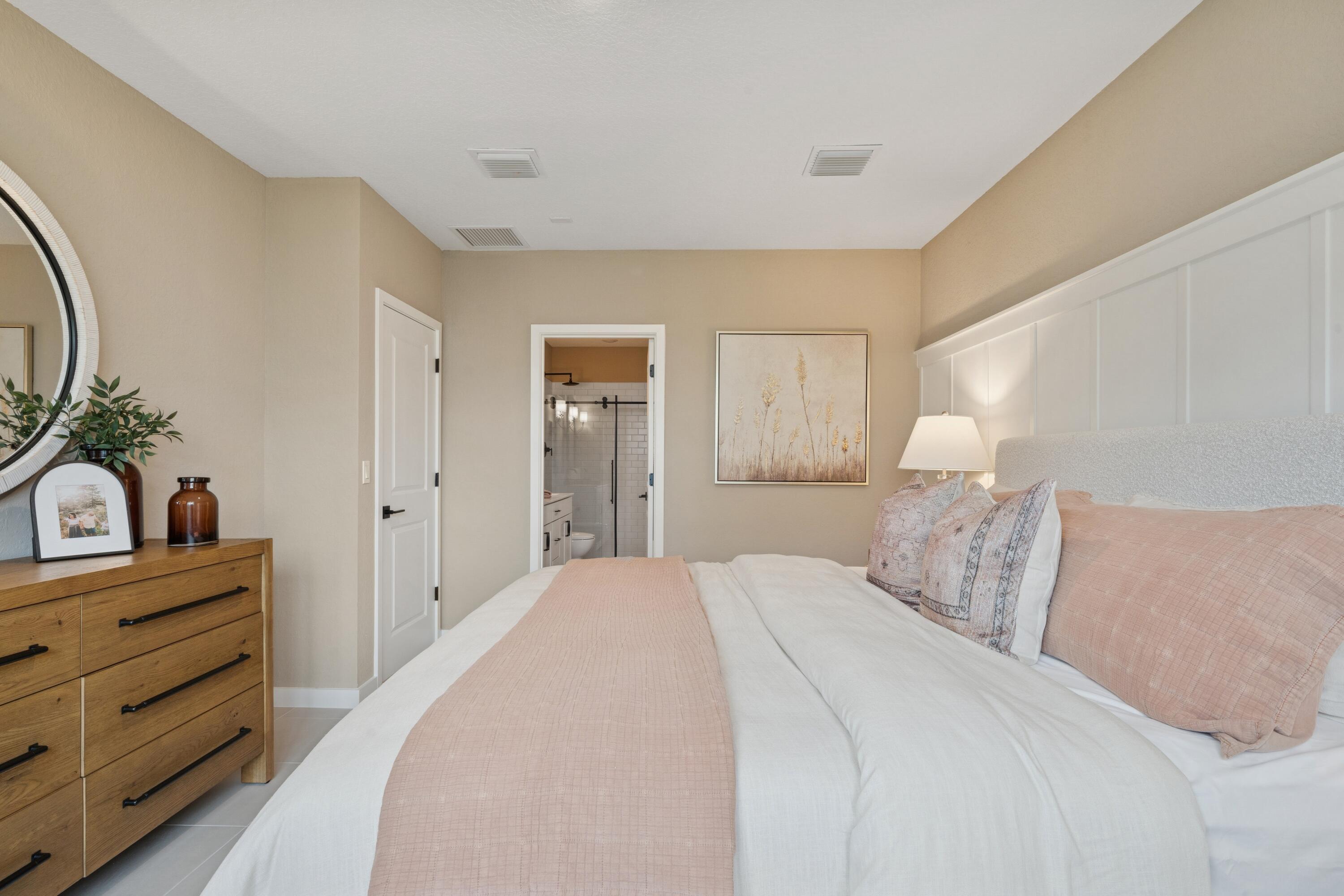 9744 Apollo Avenue, Unit 1 Fort Pierce, FL 34945 - Photo 33 of 39 a bedroom with a bed and a dresser in it