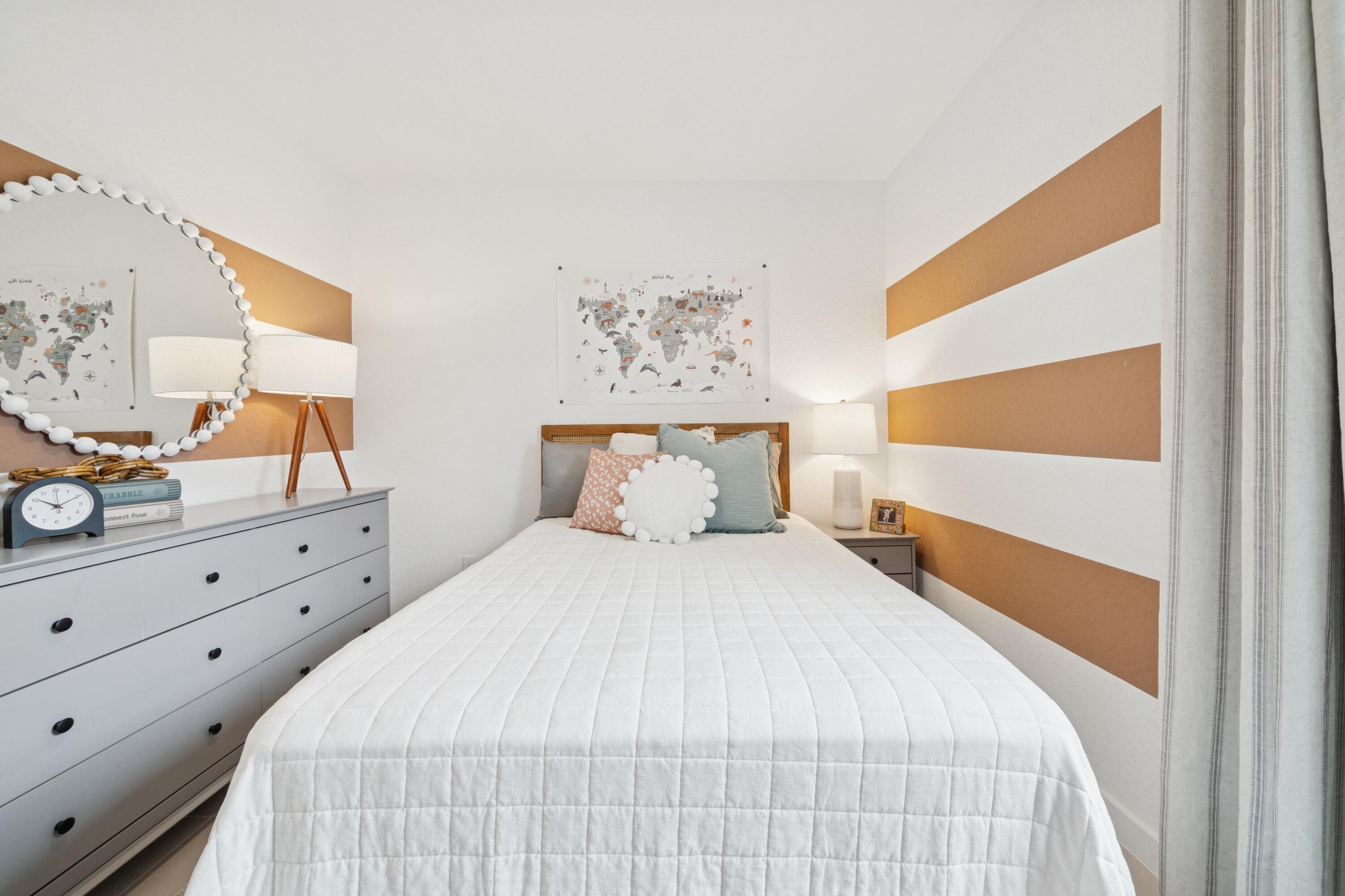 9744 Apollo Avenue, Unit 1 Fort Pierce, FL 34945 - Photo 7 of 39 a bedroom with a bed and a window