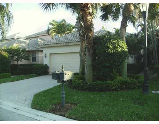 2488 Northwest 67th Street Boca Raton, FL 33496 - Photo 3 of 9 a view of a house with a yard and potted plants