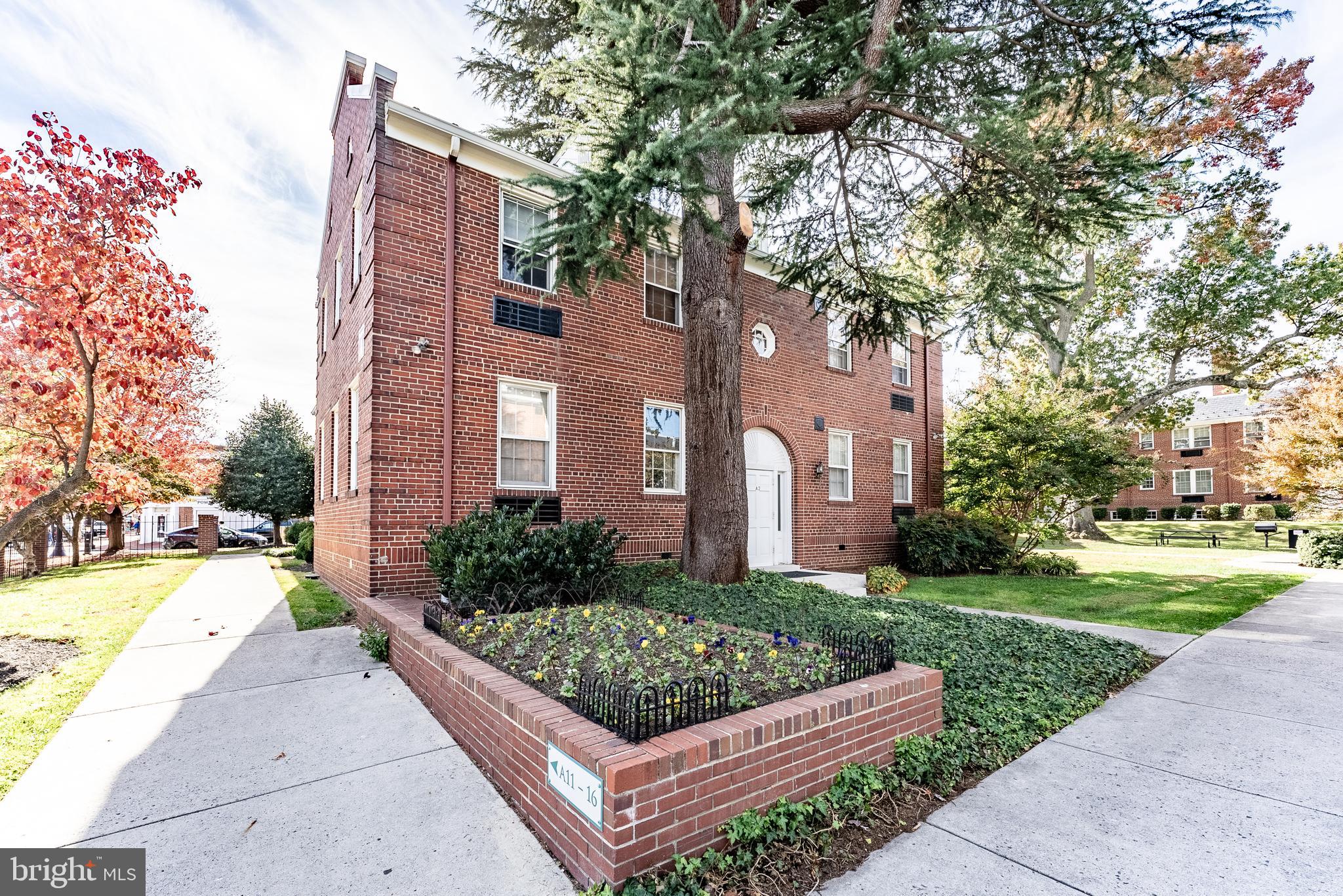 715 South Washington Street, Unit A16 Alexandria, VA 22314 - Photo 11 of 23 a view of a building with a yard