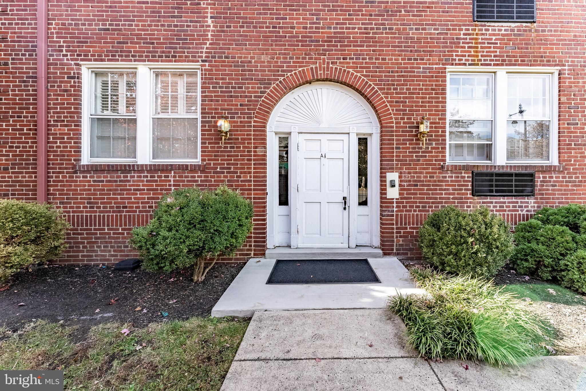 715 South Washington Street, Unit A16 Alexandria, VA 22314 - Photo 13 of 23 a front view of a house with a garden
