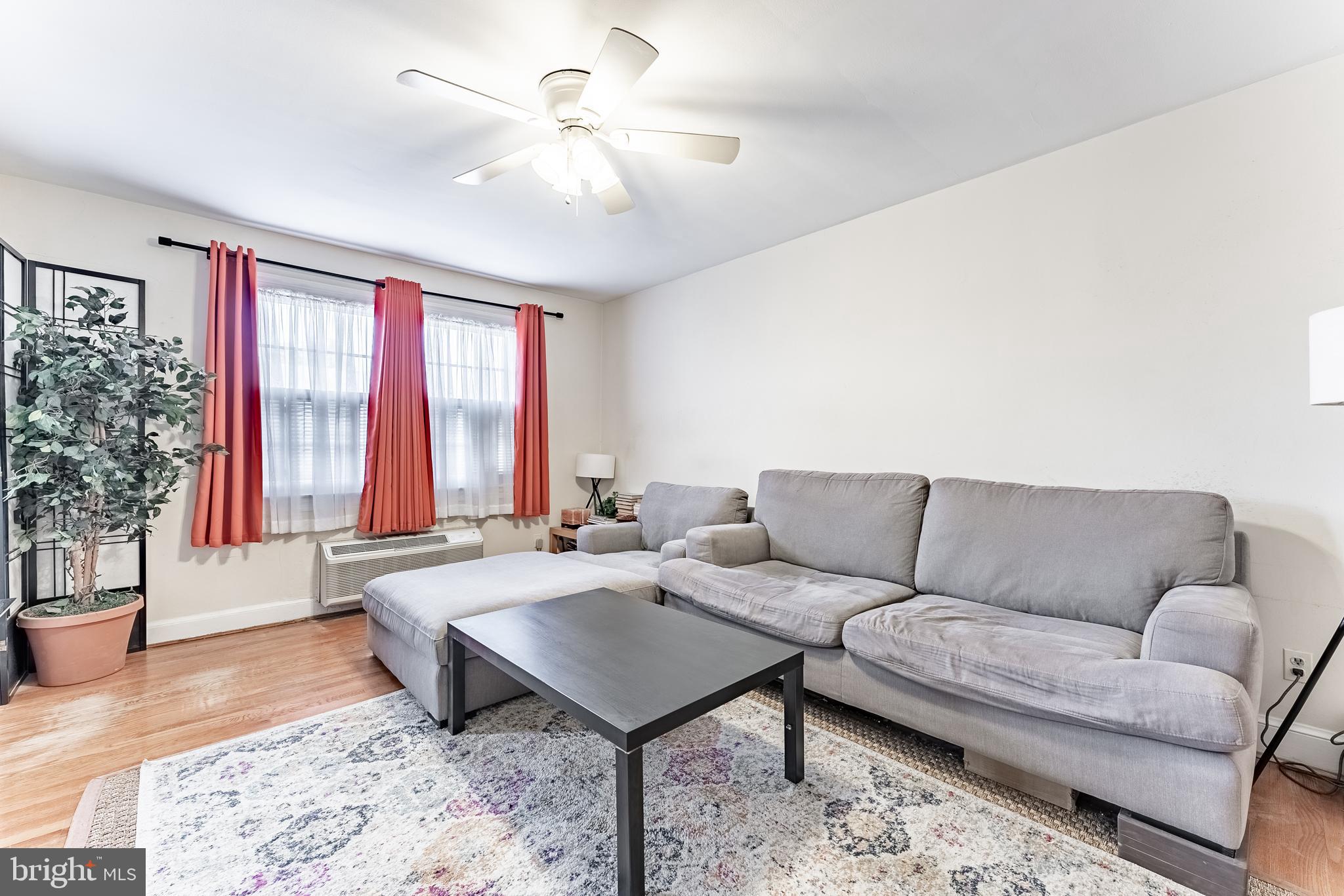 715 South Washington Street, Unit A16 Alexandria, VA 22314 - Photo 18 of 23 a living room with furniture and a large window