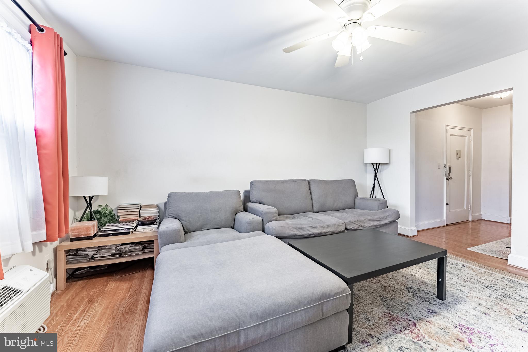 715 South Washington Street, Unit A16 Alexandria, VA 22314 - Photo 20 of 23 a living room with furniture and a chandelier