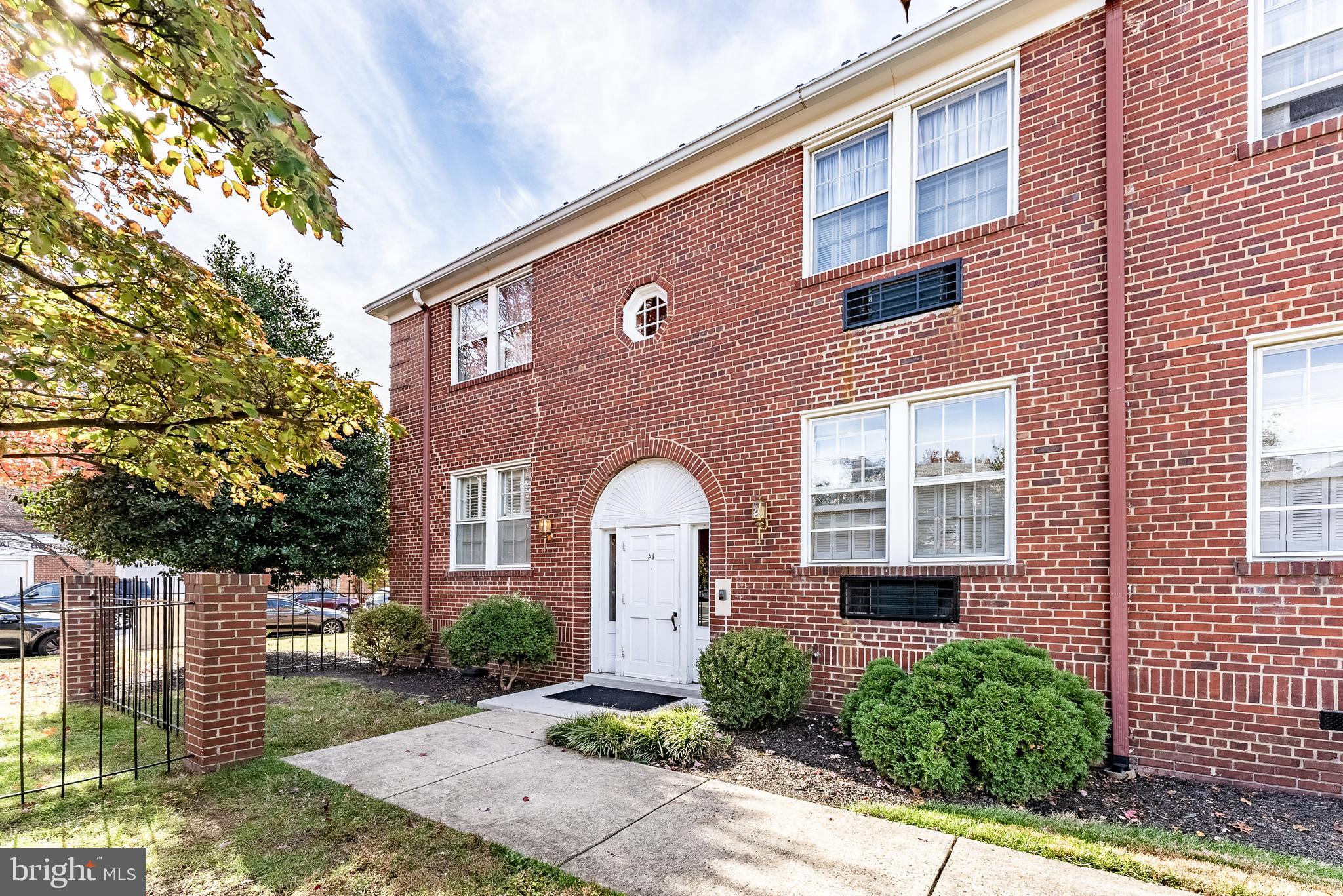 715 South Washington Street, Unit A16 Alexandria, VA 22314 - Photo 2 of 23 a front view of a house with a yard