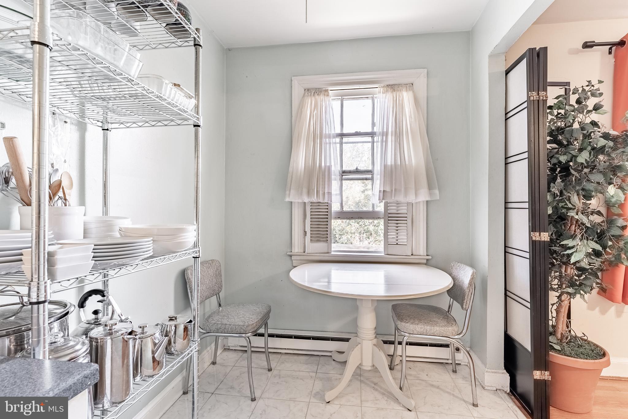 715 South Washington Street, Unit A16 Alexandria, VA 22314 - Photo 22 of 23 a view of a dining room with furniture window and outside view