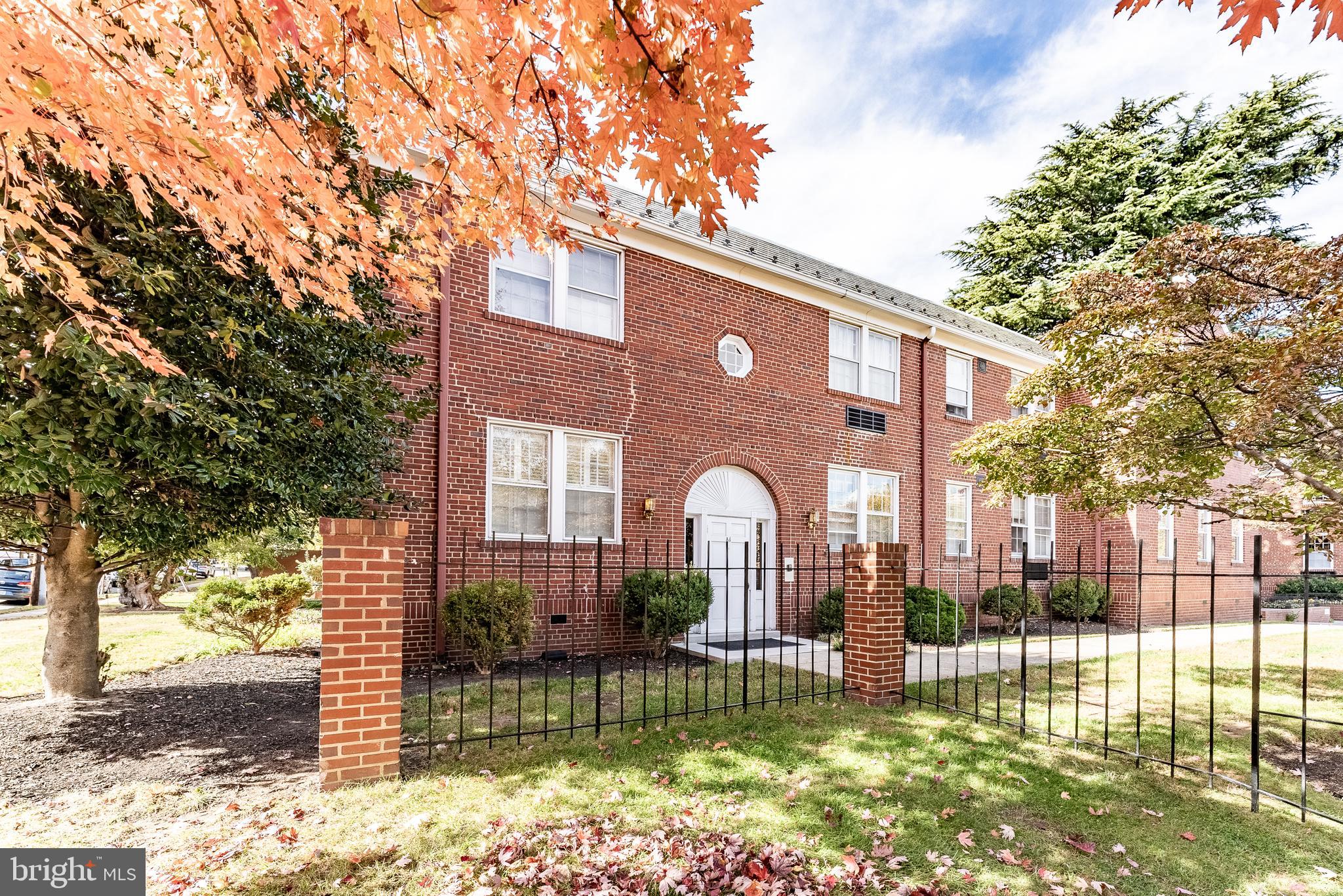715 South Washington Street, Unit A16 Alexandria, VA 22314 - Photo 3 of 23 a front view of a house with a garden
