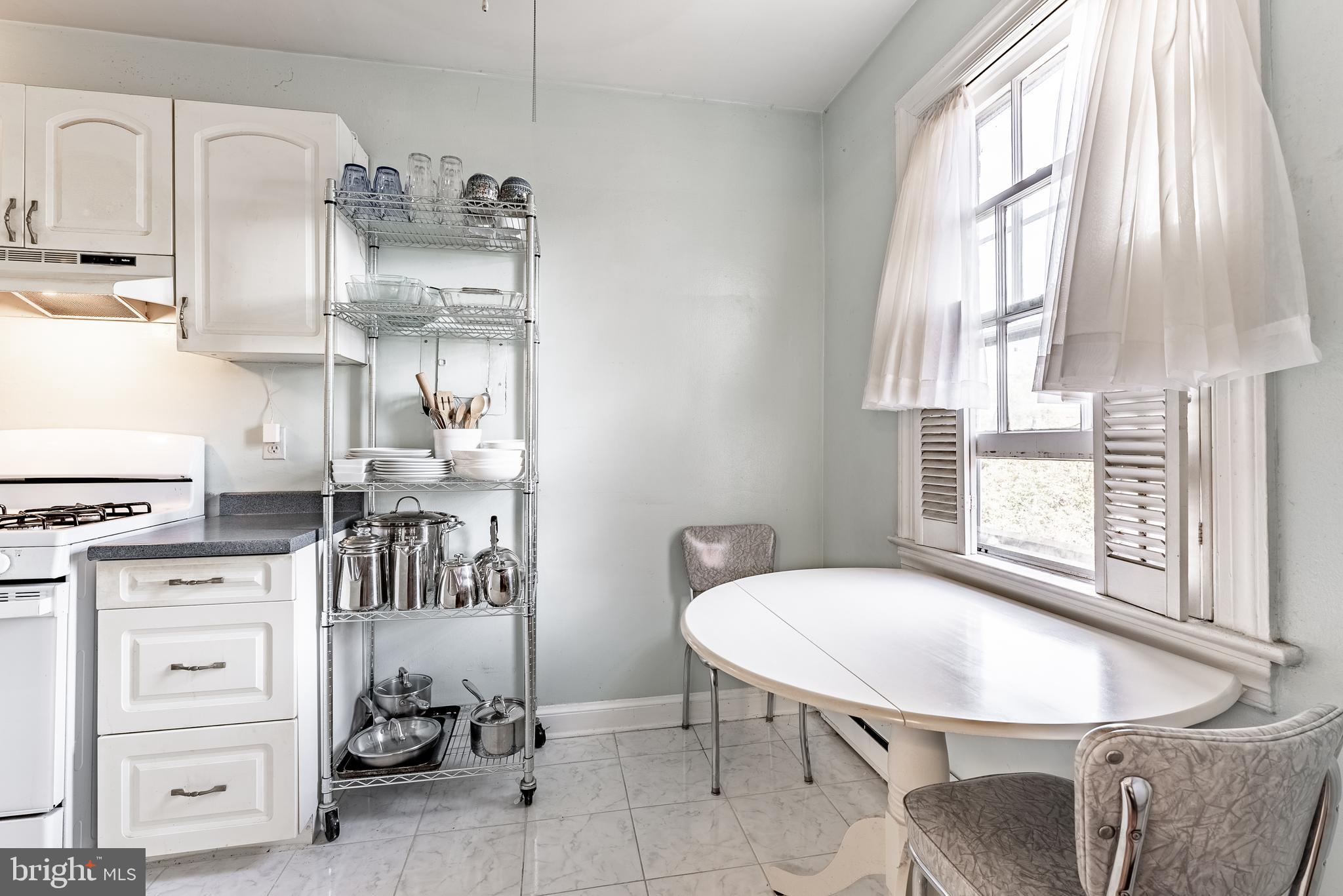 715 South Washington Street, Unit A16 Alexandria, VA 22314 - Photo 7 of 23 a dining room with furniture and window