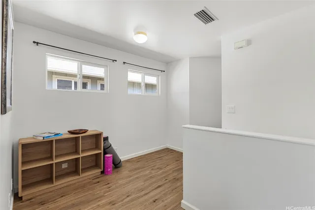 a room with a hardwood and a window