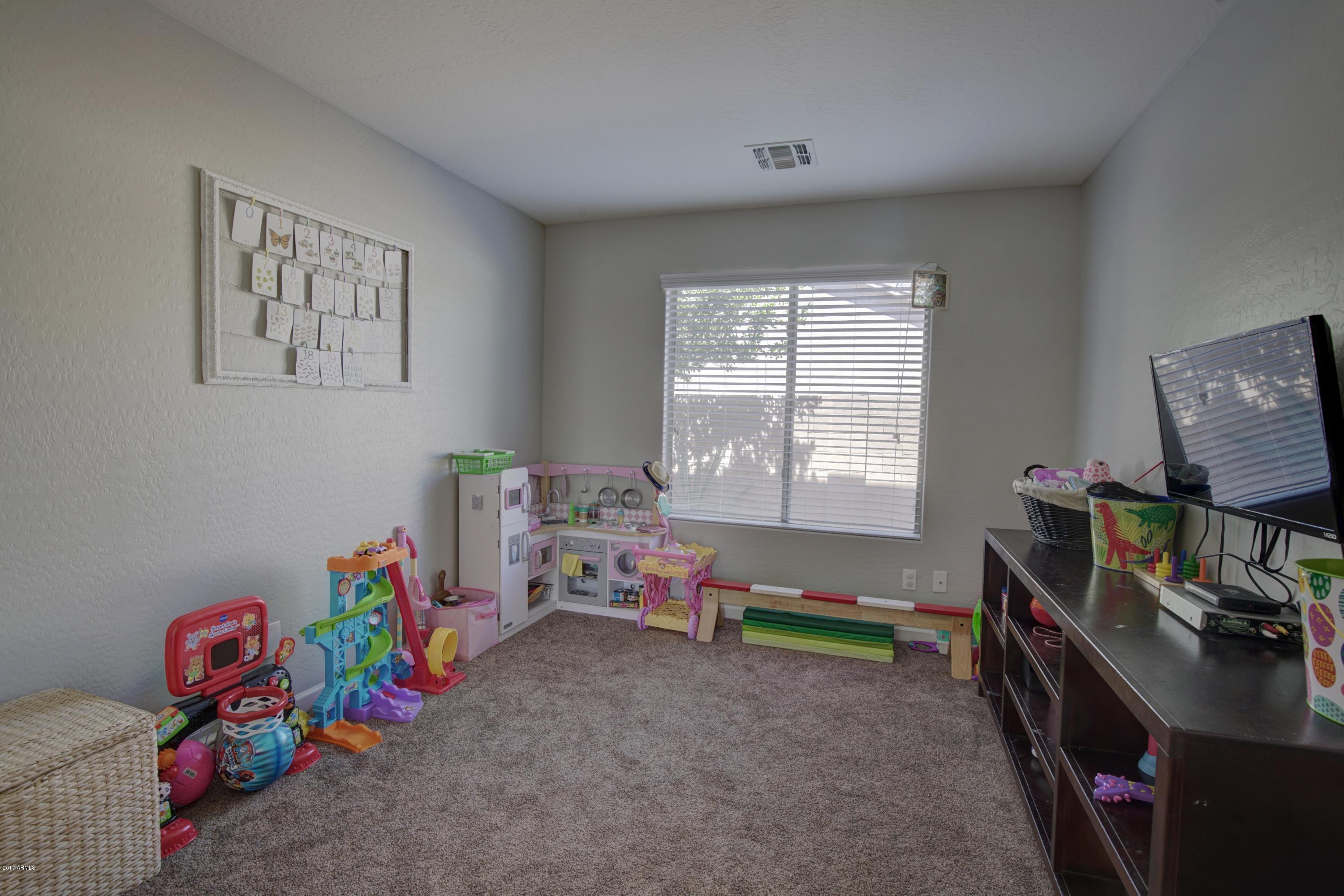 4253 East Ivanhoe Street Gilbert, AZ 85295 - Photo 17 of 35 Downstairs bedroom