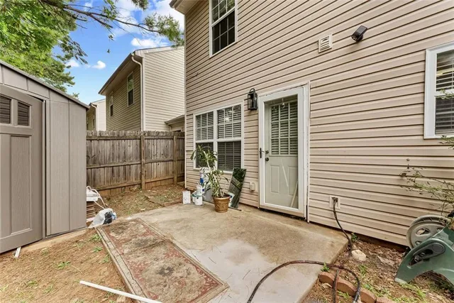 a view of a chair and table in front of house