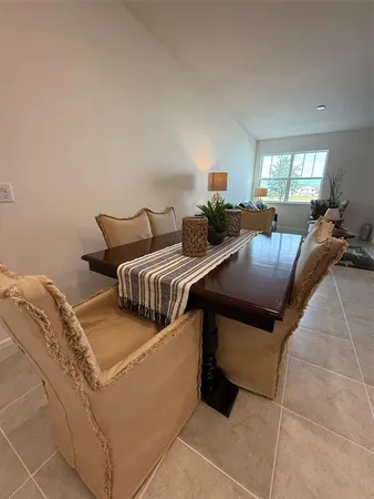a living room with furniture and a lamp