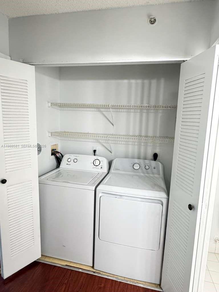 2173 Renaissance Boulevard, Unit 101 Miramar, FL 33025 - Photo 11 of 27 a utility room with dryer and washer