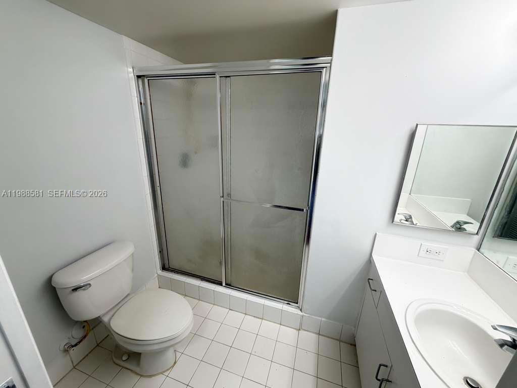 2173 Renaissance Boulevard, Unit 101 Miramar, FL 33025 - Photo 16 of 27 a bathroom with a toilet and a shower