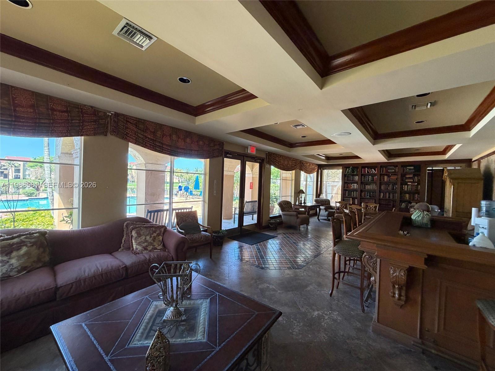 2173 Renaissance Boulevard, Unit 101 Miramar, FL 33025 - Photo 22 of 27 a living room with furniture and a large window