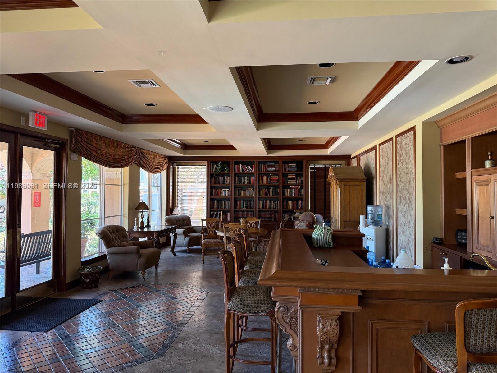 2173 Renaissance Boulevard, Unit 101 Miramar, FL 33025 - Photo 23 of 27 a living room with lots of furniture and a large window