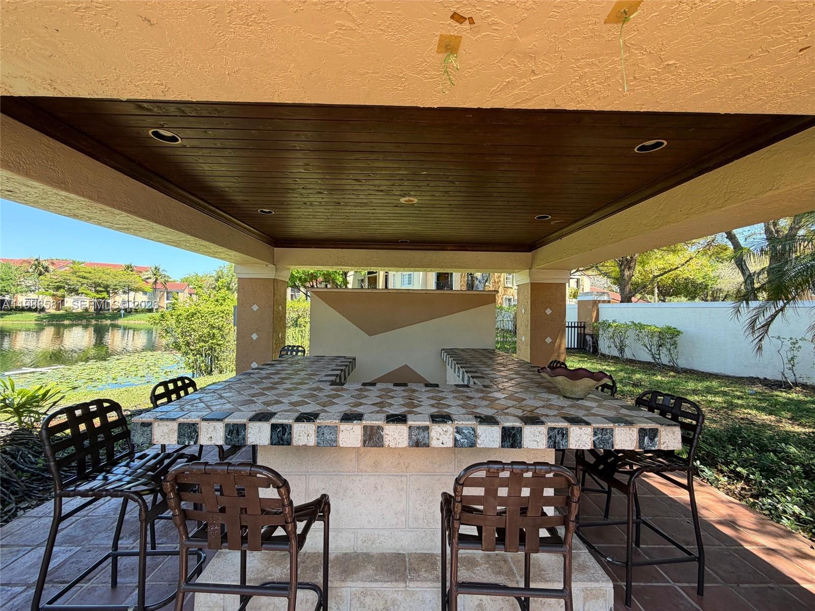 2173 Renaissance Boulevard, Unit 101 Miramar, FL 33025 - Photo 25 of 27 a view of swimming pool with outdoor seating