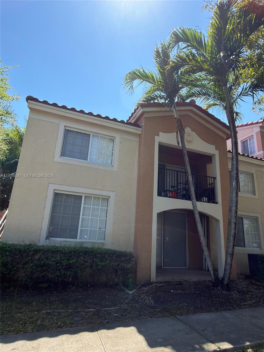 2173 Renaissance Boulevard, Unit 101 Miramar, FL 33025 - Photo 3 of 27 a house that has a tree in front of it