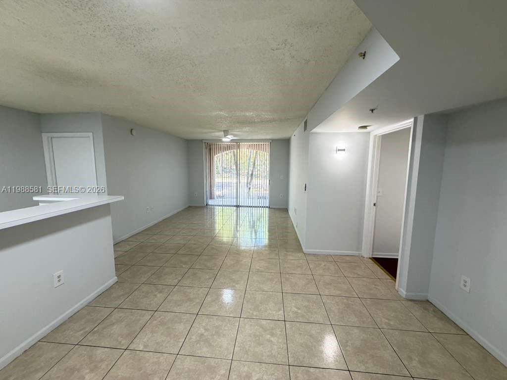 2173 Renaissance Boulevard, Unit 101 Miramar, FL 33025 - Photo 5 of 27 a view of an empty room and window