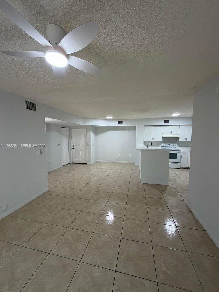 2173 Renaissance Boulevard, Unit 101 Miramar, FL 33025 - Photo 6 of 27 a room with a cabinets and appliances