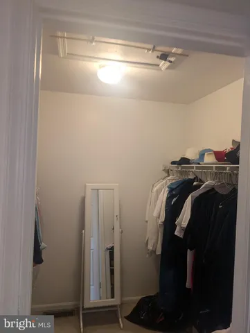 a bathroom with a toilet a sink and a window