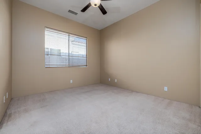 an empty room with closet area