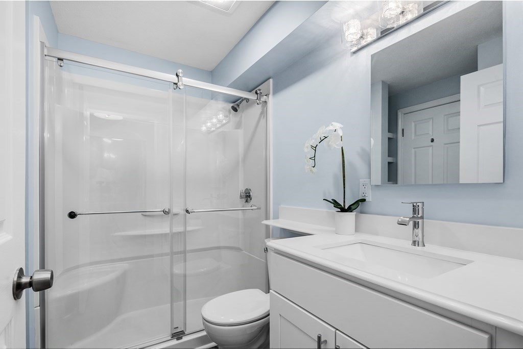 19 Beal's Cove Road, Unit K Hingham, MA 02043 - Photo 8 of 14 a bathroom with a sink toilet and shower