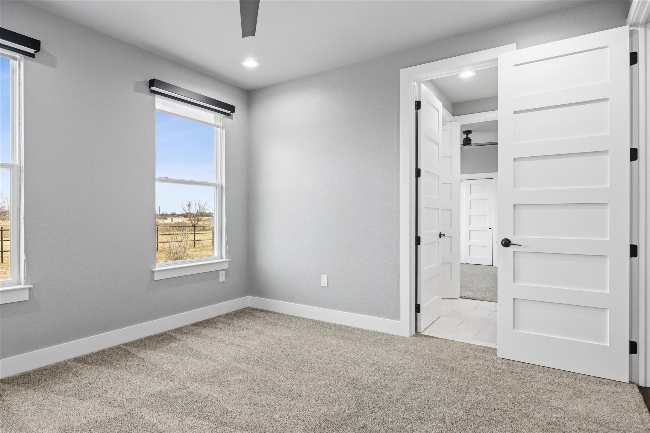 178 Balch Road Elgin, TX 78621 - Photo 20 of 40 an empty room with windows and closet