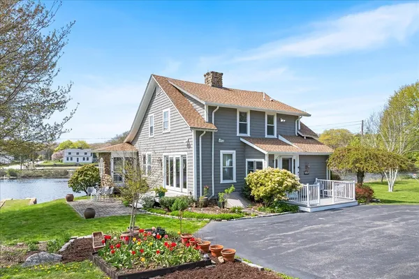 a front view of a house with garden