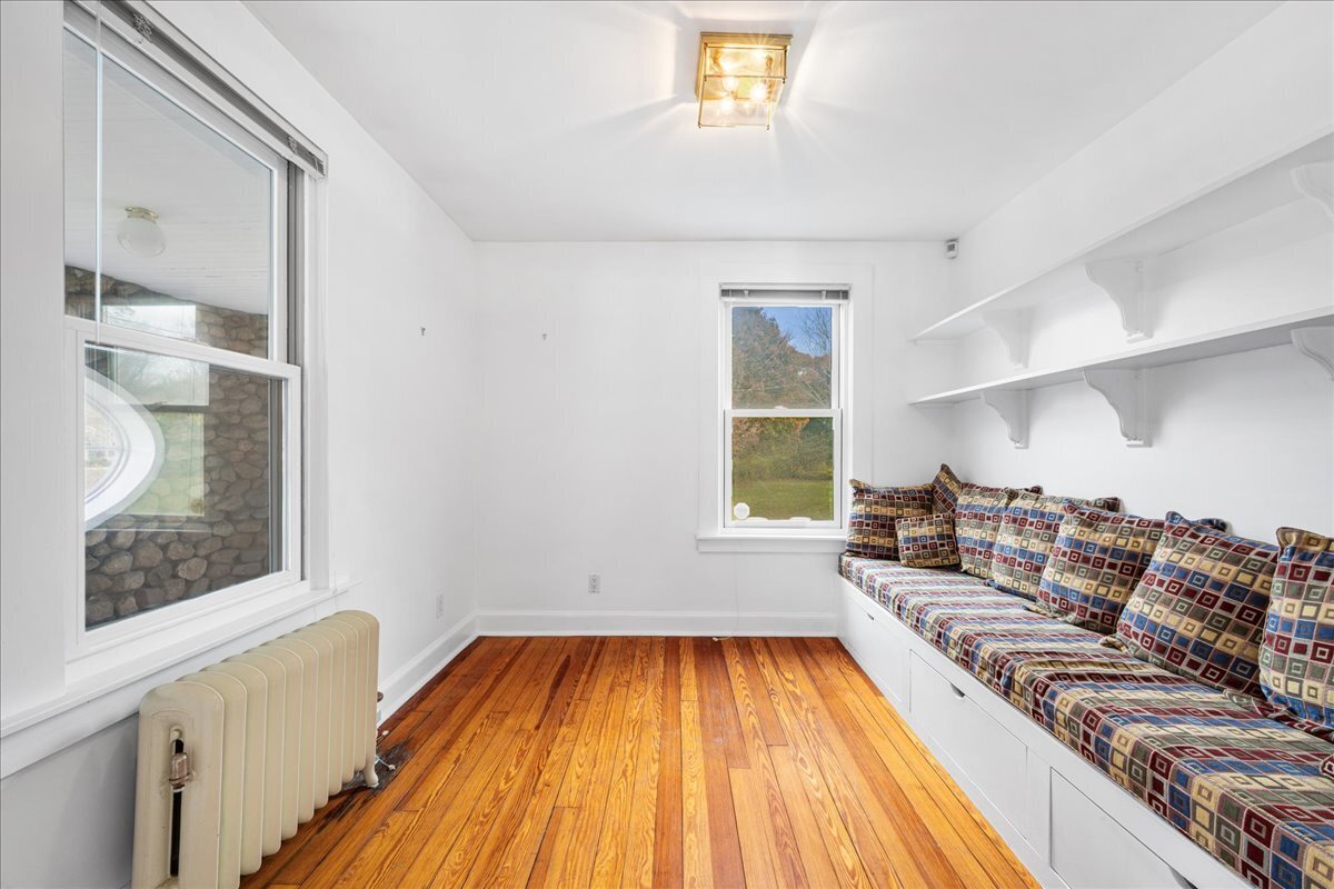 28 Palmer Neck Road Pawcatuck, CT 06379 - Photo 17 of 36 a living room with a couch and a rug