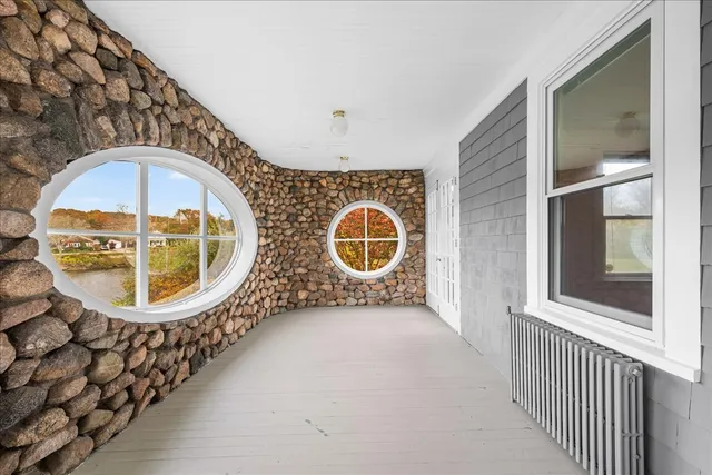a bathroom with a sink mirror and toilet