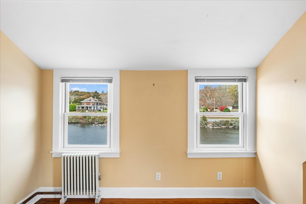 28 Palmer Neck Road Pawcatuck, CT 06379 - Photo 31 of 36 a view of an empty room with a window