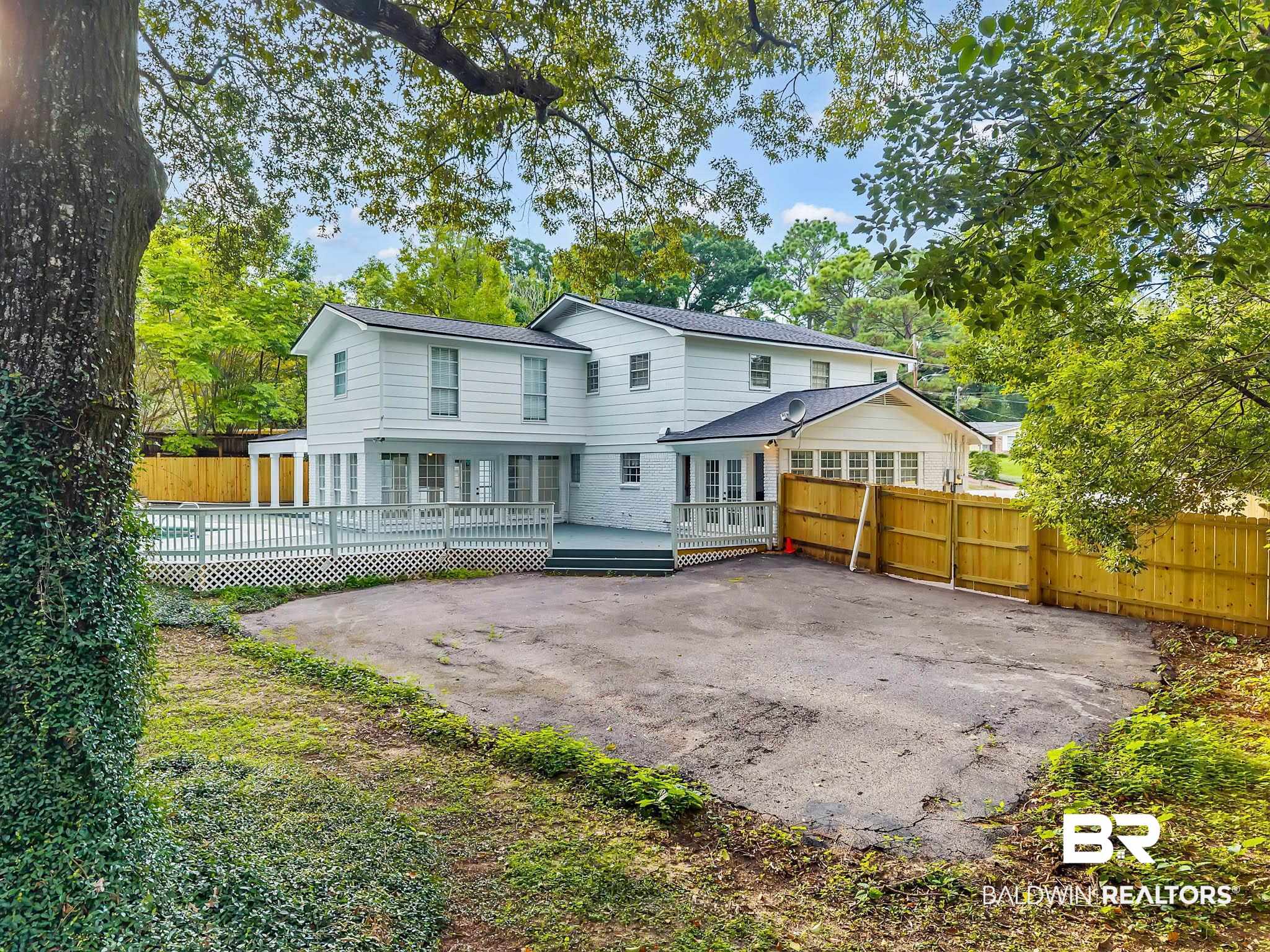 4705 Sherry Court Mobile, AL 36693 - Photo 77 of 100 Rear view of property featuring a wooden deck and a patio