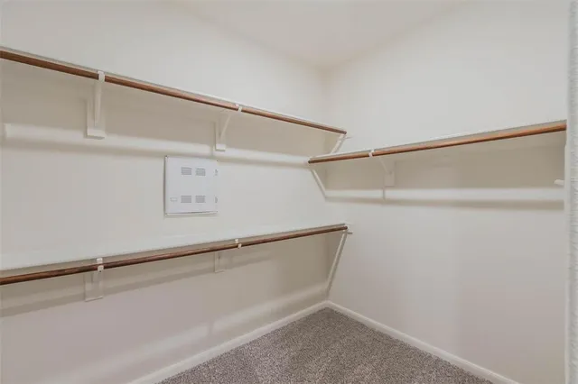 a view of an empty walk in closet