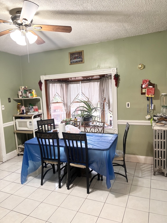 139 Grove Street Chelsea, MA 02150 - Photo 3 of 19 a view of a dining room with furniture