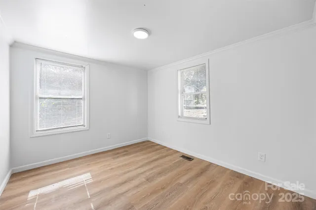 an empty room with windows