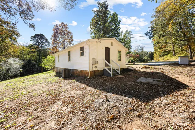 a view of a house with a yard covered in snow