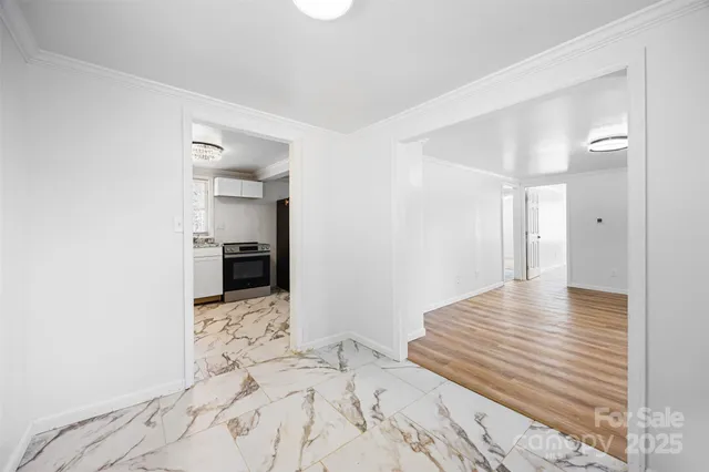 a view of a bedroom with wooden floor and bedroom