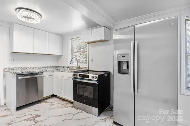 a kitchen with a stove and a refrigerator