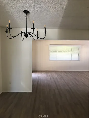 a view of an empty room with windows