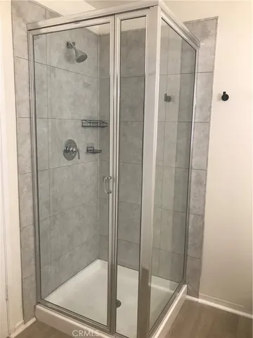 a bathroom with a shower and toilet