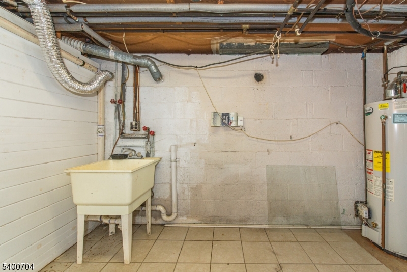 17 Cedar Street Bloomfield, NJ 07003 - Photo 14 of 21 a bathroom with a sink and a mirror