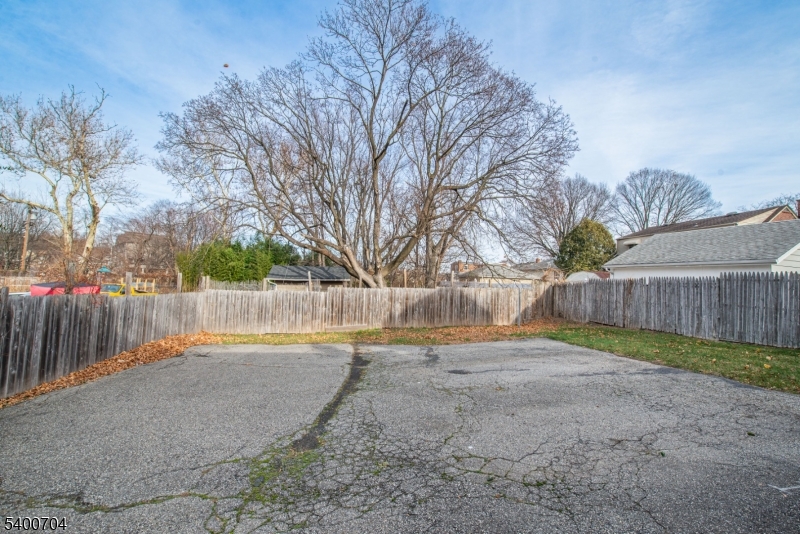17 Cedar Street Bloomfield, NJ 07003 - Photo 18 of 21 a view of backyard with wooden fence