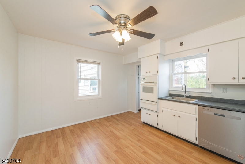 17 Cedar Street Bloomfield, NJ 07003 - Photo 8 of 21 a bedroom with a large bed window and cabinets