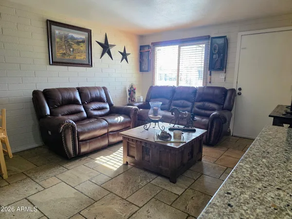 a living room with furniture and a window
